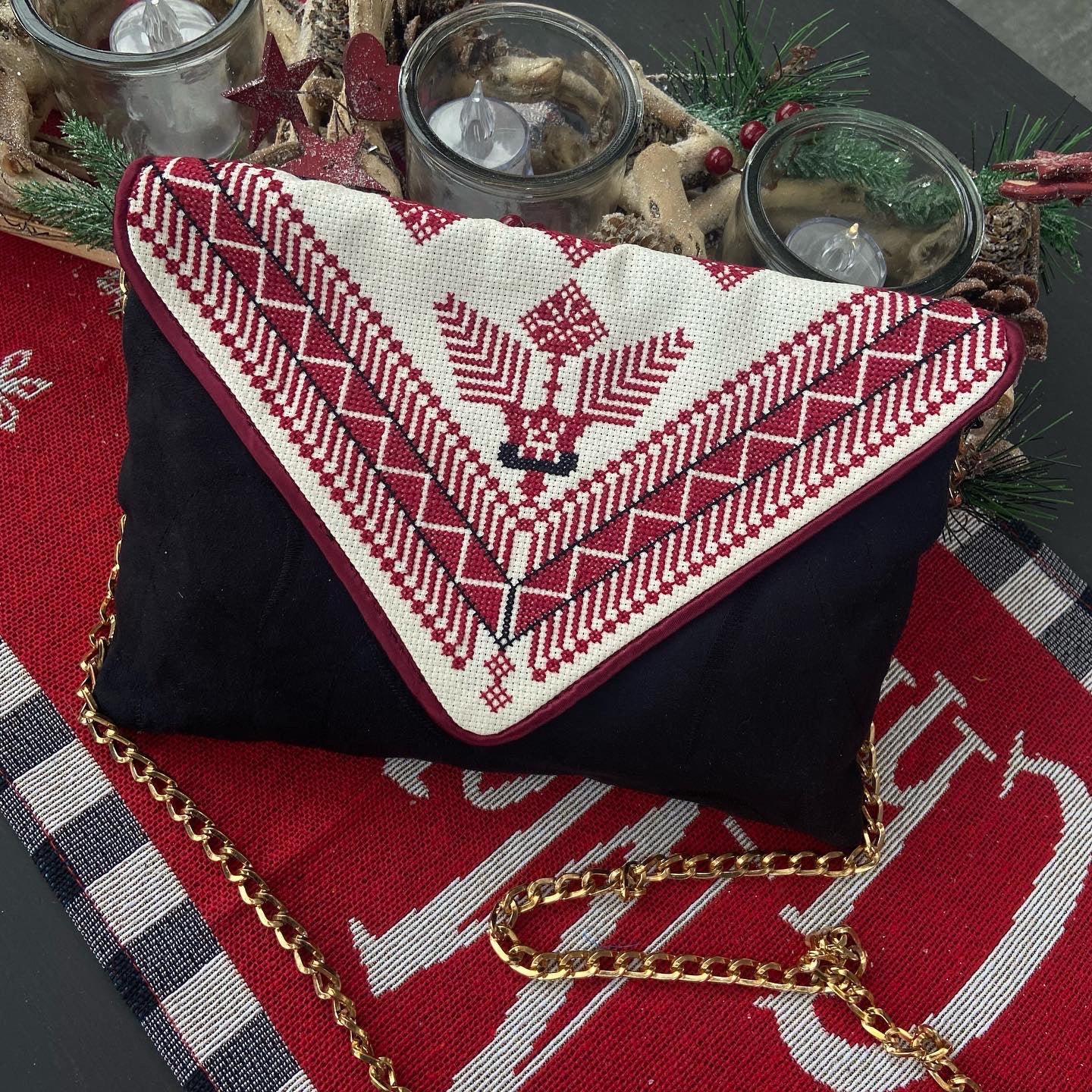 Traditional hand embroidered black velvet clutch , from Nabila’s Creations
