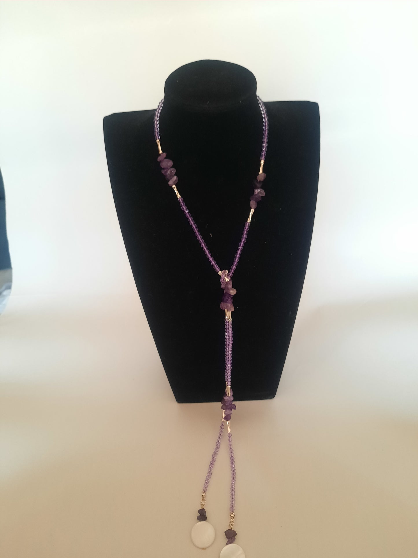 Gold plated tall necklace with amatist stones and shell