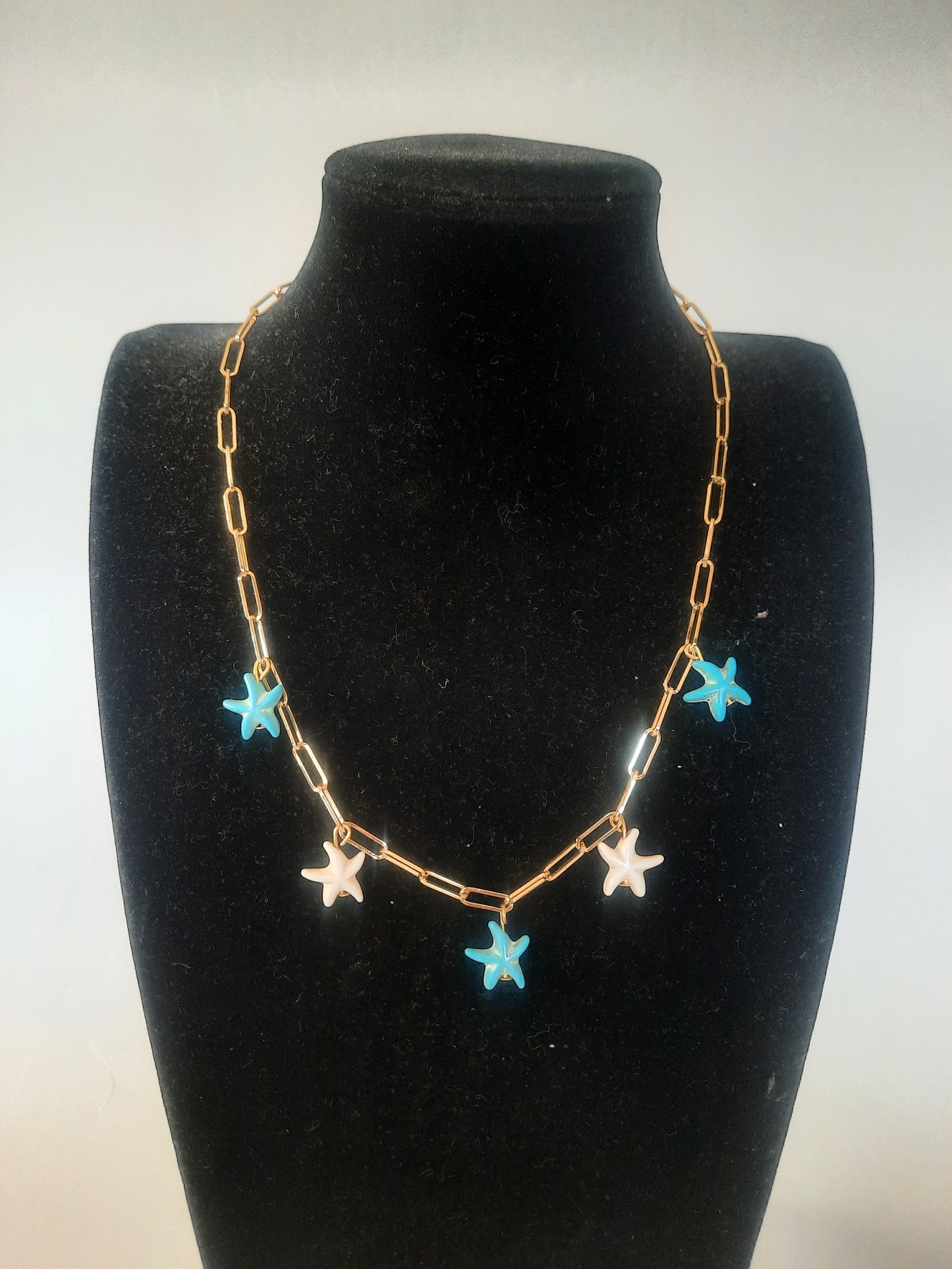Gold plated piper clip necklace with starfish